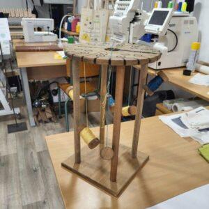 Professional wooden bobbins and upcycled threads prepared for a workshop Kumihimo braiding experience at Atelier de Tressage. Discover Kumihimo braiding Kumihimo braiding workshop