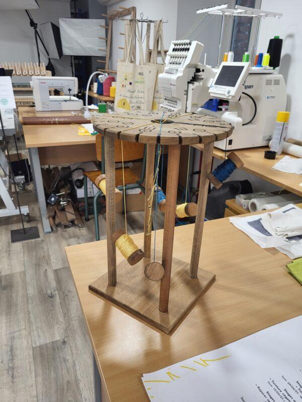 Professional wooden bobbins and upcycled threads prepared for a workshop Kumihimo braiding experience at Atelier de Tressage. Discover Kumihimo braiding Kumihimo braiding workshop